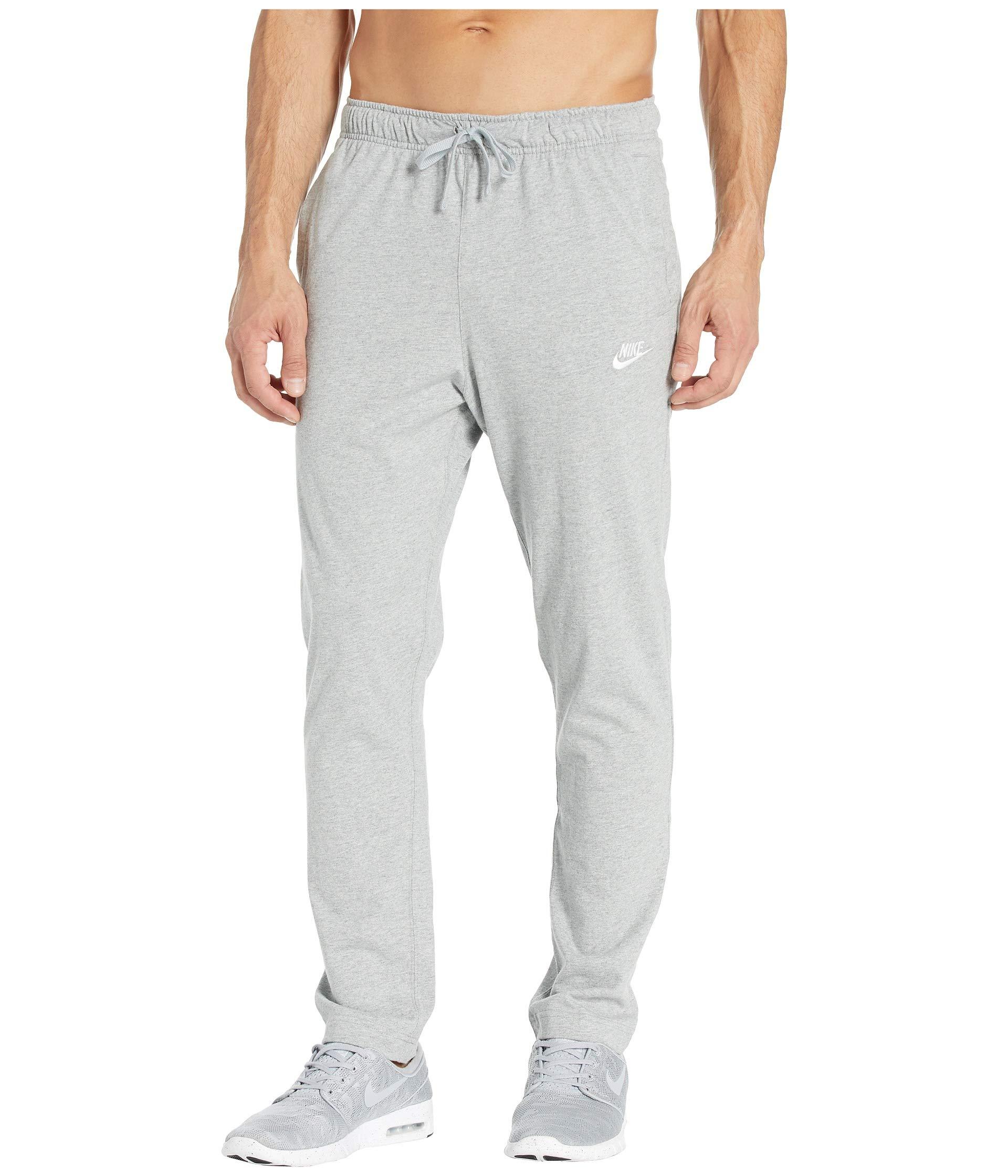 nike open hem club pants