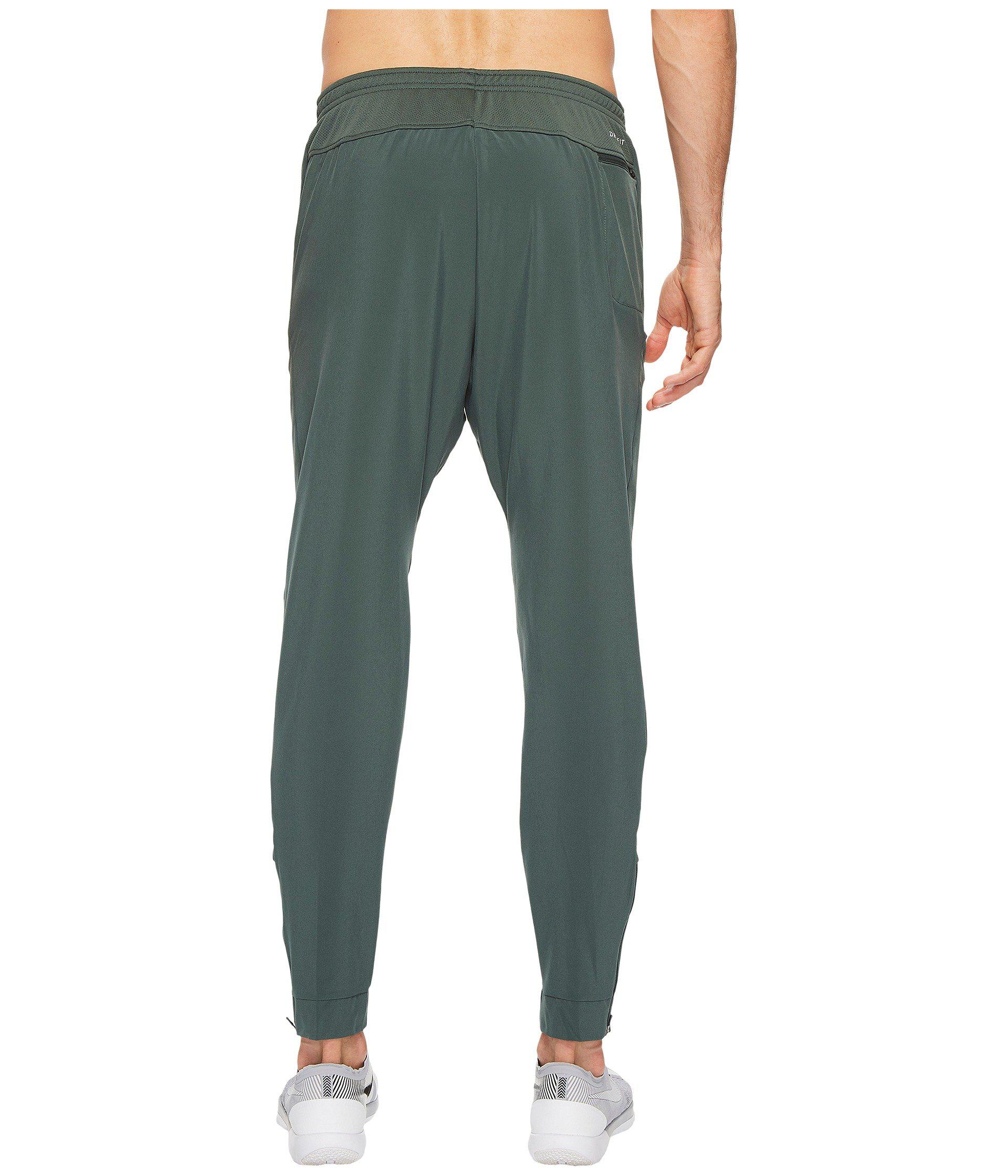 nike flex essential woven pants