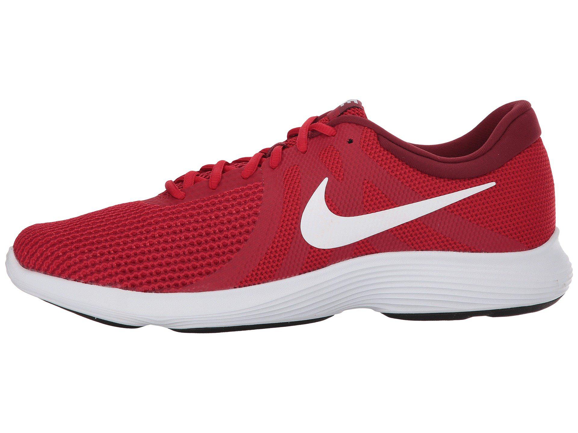 red nike shoes with white swoosh