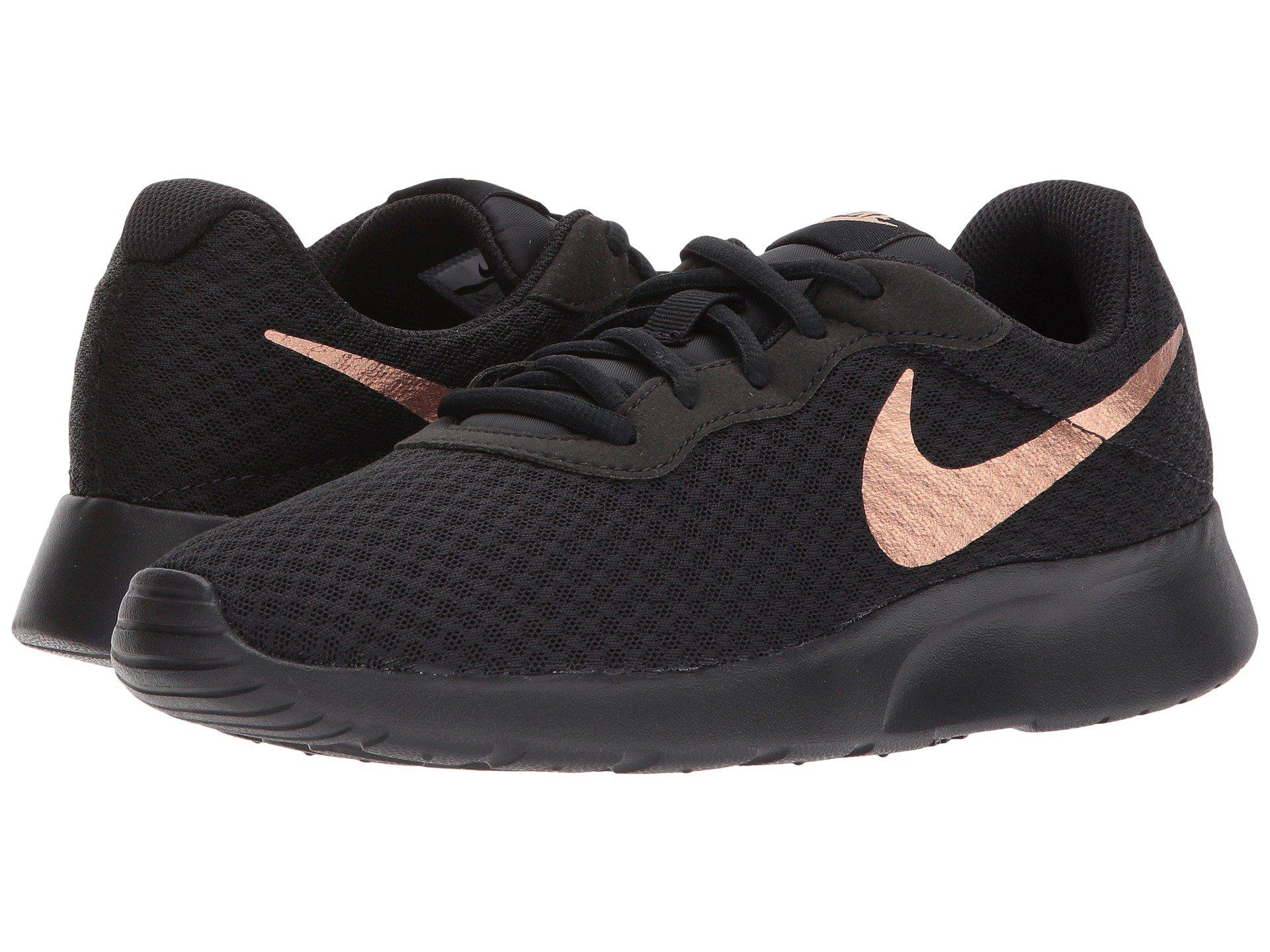 nike tanjun women's athletic shoes black and gold