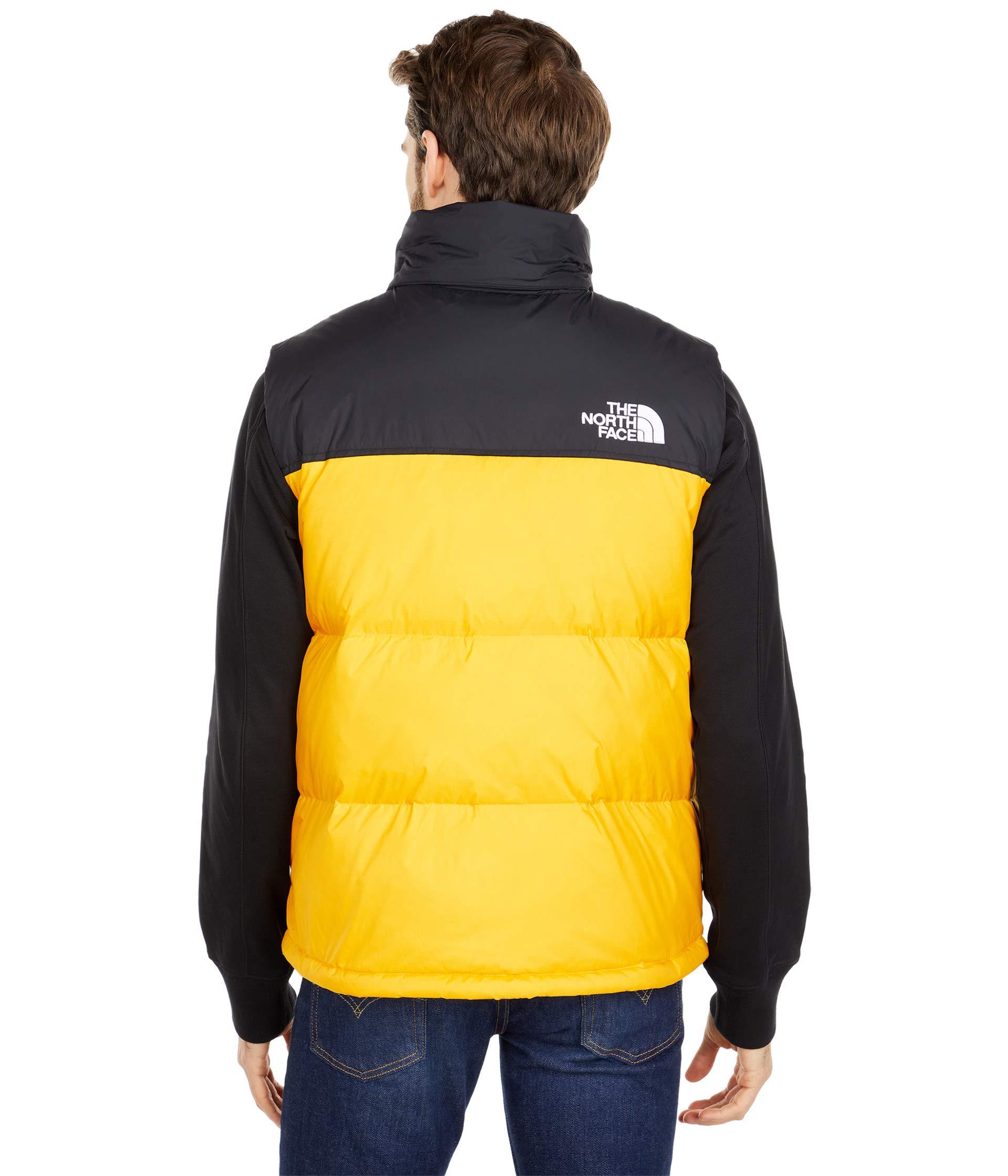 yellow north face vest