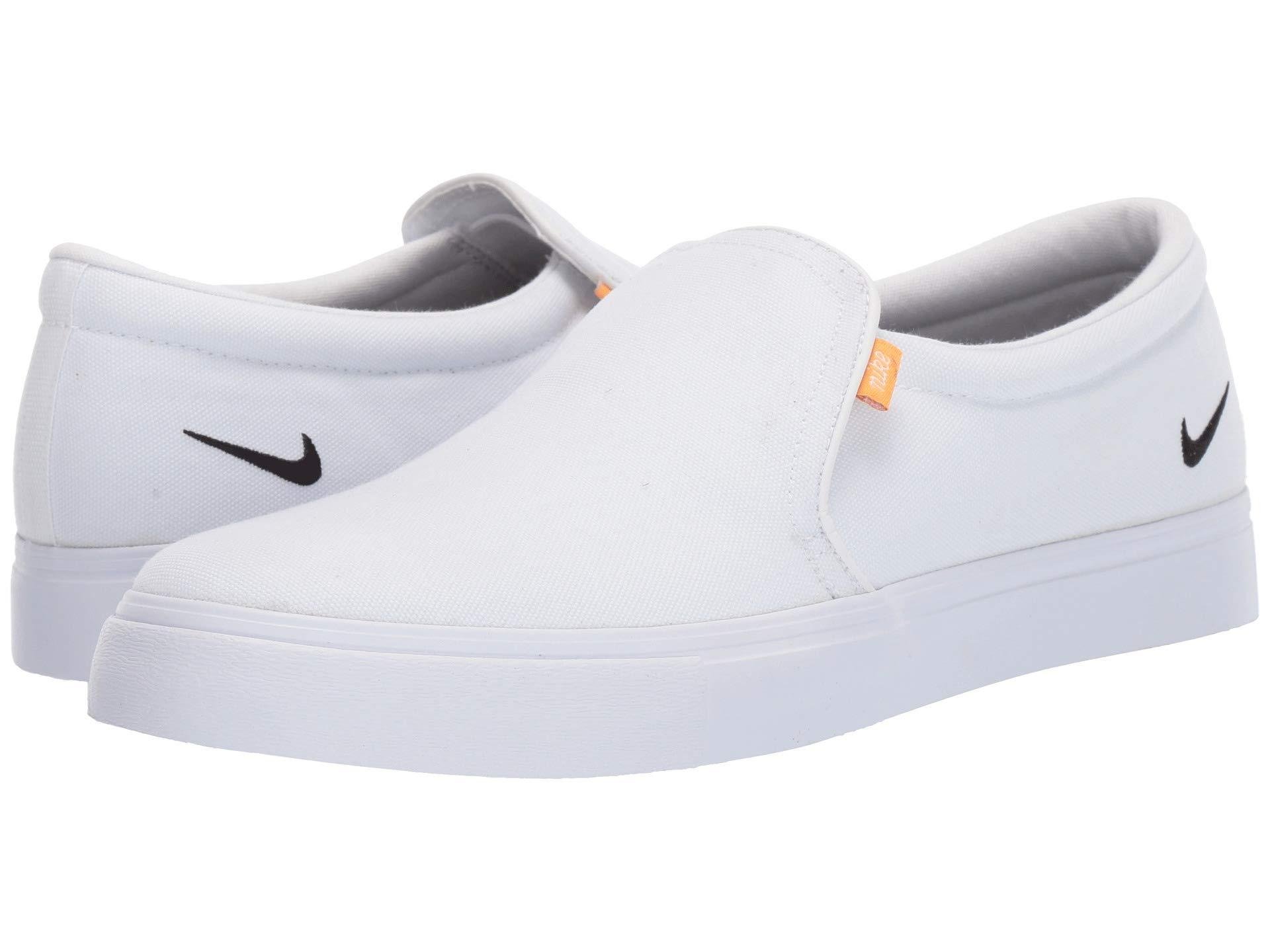 black and white nike slip ons